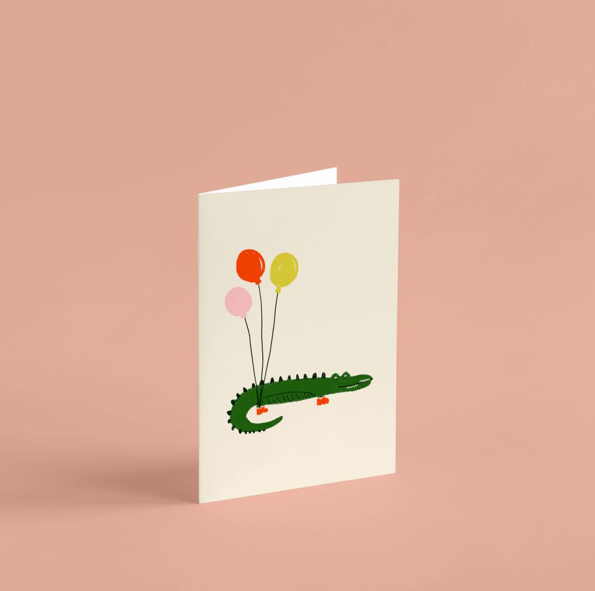 Tarjeta ilustrada de cumpleaños · Cocodrilo con globos